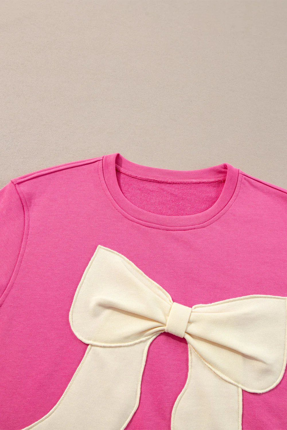 Strawberry Pink Contrasting Color Ribbon Bow Front Patch Loose Tee with Slits - Image 8